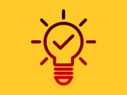 Outline of a light bulb with a check mark inside, surrounded by rays, on a yellow background.