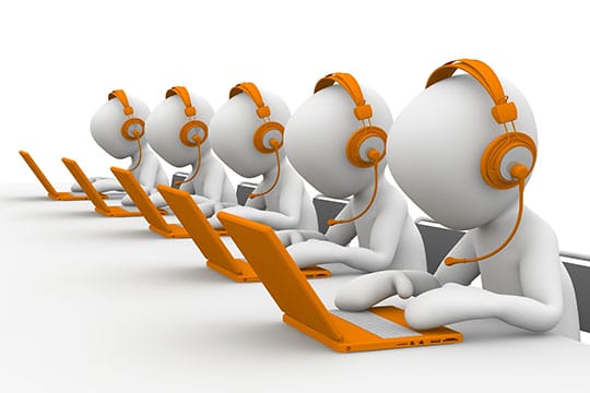 Illustration of five white humanoid figures wearing orange headsets and using laptops, depicting a call center or customer service environment.