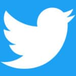 White Twitter bird logo on a blue background.