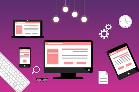 A group of computers, laptops, tablets and smartphones on a purple background showing a responsive website.