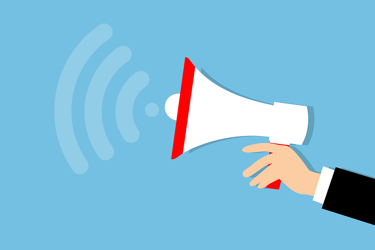 Illustration of a hand holding a red and white megaphone emitting sound waves against a blue background.