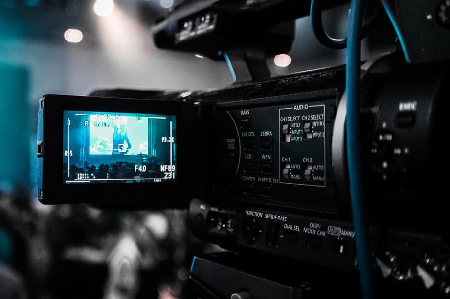 A video camera is being used at an event.