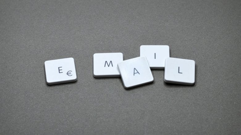 The word email spelled out on a gray surface.