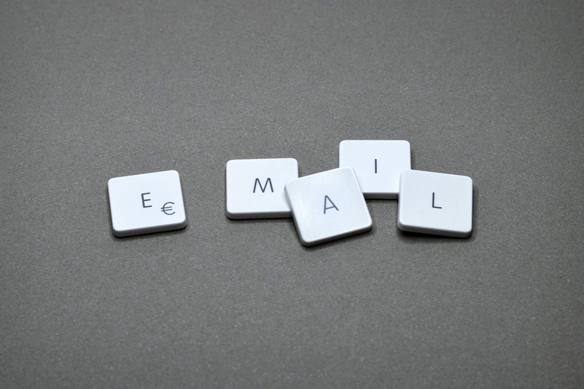 The word email spelled out on a gray surface.