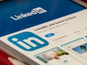 The linkedin logo is displayed on a tablet.