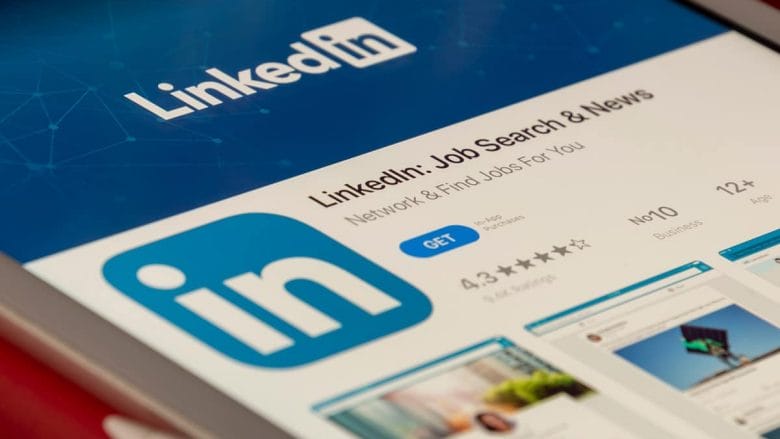 The linkedin logo is displayed on a tablet.
