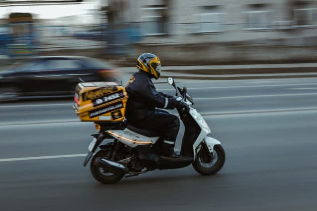 motion-blur-on-time-delivery-vehicle-transport-motorcycle-scooter