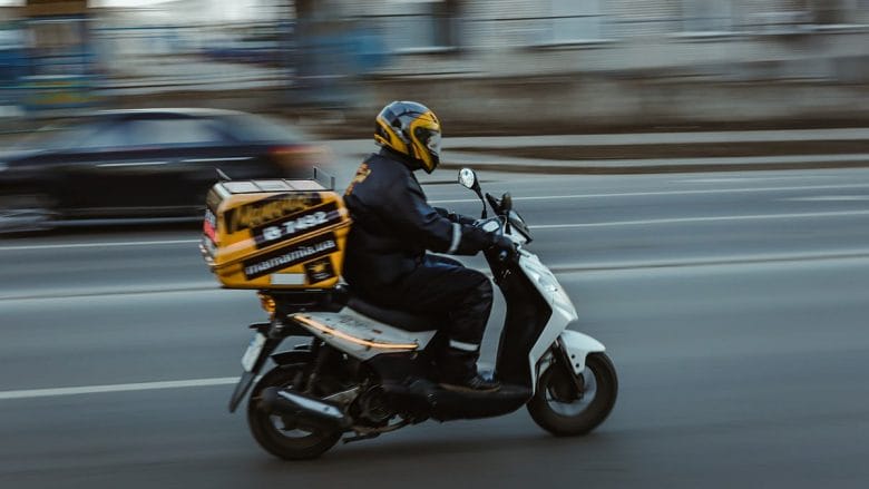 motion-blur-on-time-delivery-vehicle-transport-motorcycle-scooter