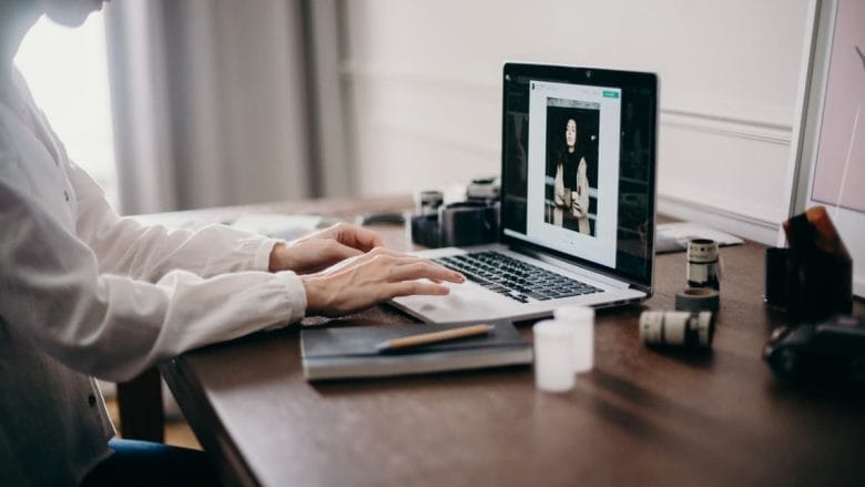 A woman working on her laptop at home.