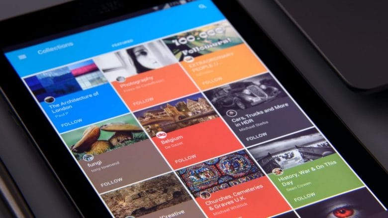 A tablet displaying a collection of pictures on the screen.