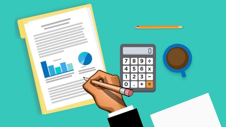 A hand writing on paper near a report with graphs, a calculator, a pencil, and a cup of coffee on a teal background.