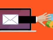 Illustration of a hand reaching from a laptop screen toward a credit card and cash, symbolizing online fraud or phishing.