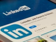 Linkedin mobile application page showing on a tablet screen with the download button and app rating visible.