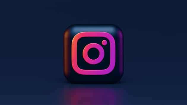 A 3D square icon with the Instagram logo in pink and orange gradient on a dark blue background.