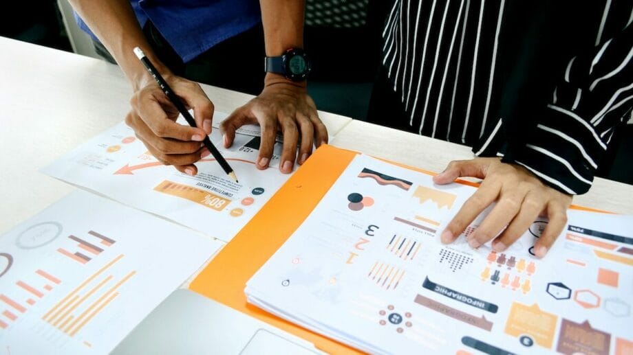 A group of people working on a spreadsheet.