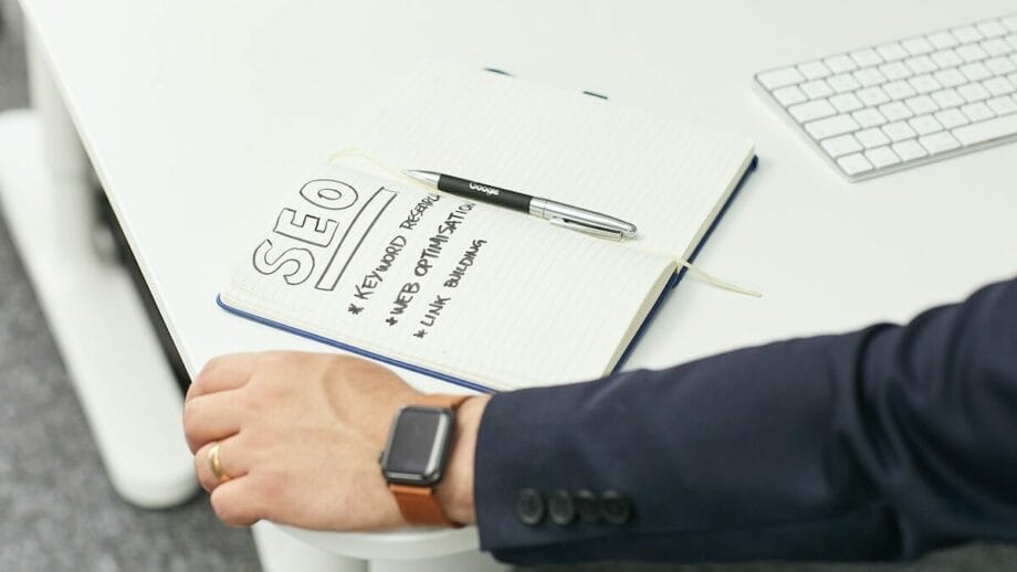 a person writing on a piece of paper