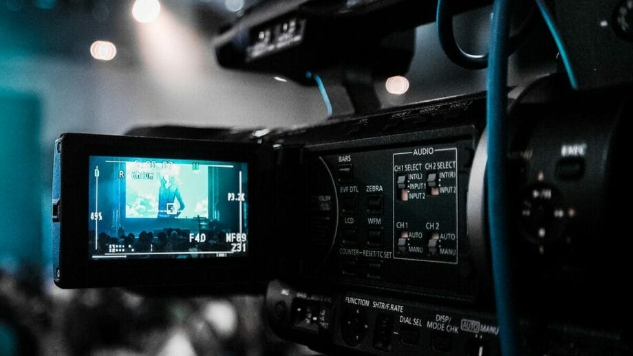 A video camera is being used at an event.