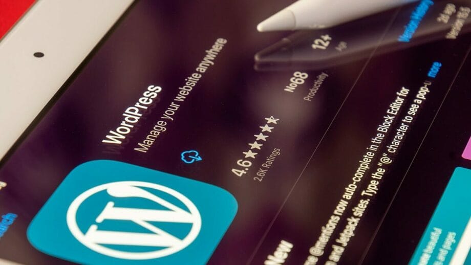 A wordpress app on an ipad with a pen on it.