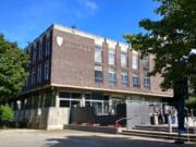The Liverpool University building with people walking in front of it.