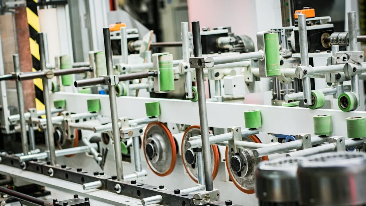 A machine is working on a conveyor belt in a factory.