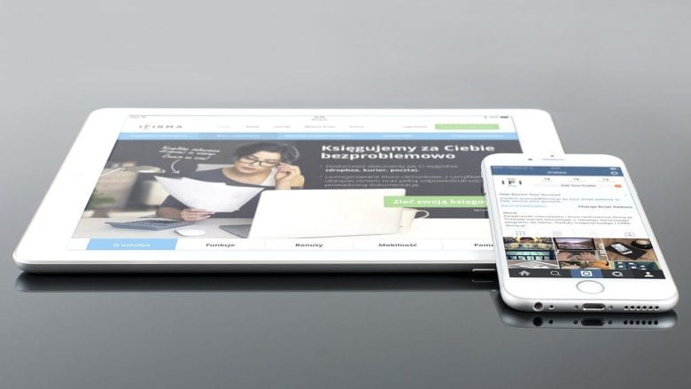 An iphone and ipad displaying a website.