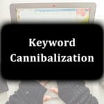 Laptop, smartphone, and coffee on a desk with "Keyword Cannibalization" text overlay.