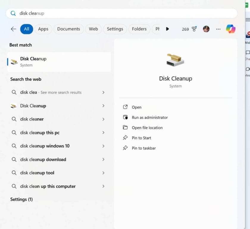 Screenshot of Windows search menu displaying results for "disk cleanup," with options to open, run as administrator, and more.