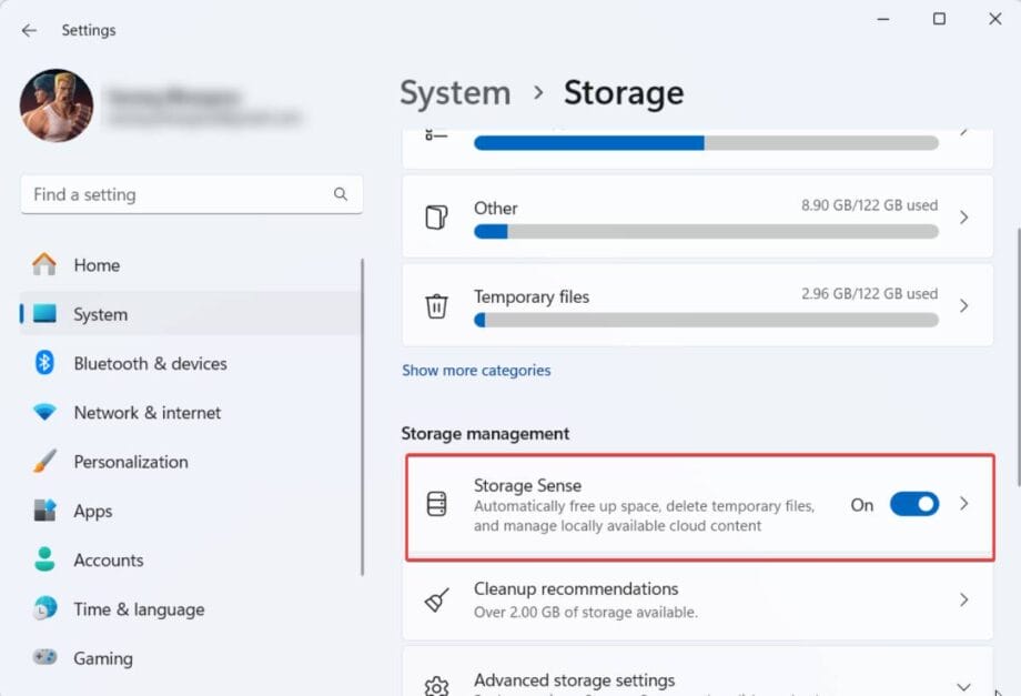 Screenshot of Windows settings showing Storage options. "Storage Sense" is highlighted with the toggle set to "On," set to free up space and manage cloud content.