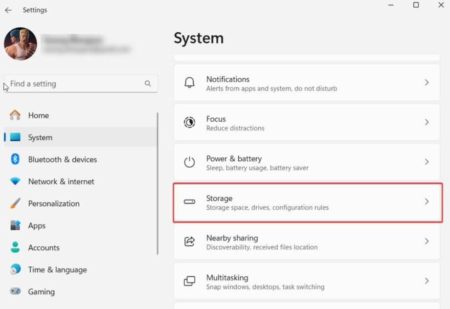 Computer settings screen showing options like Notifications, Focus, Power & battery, and Storage, with Storage section highlighted in red.