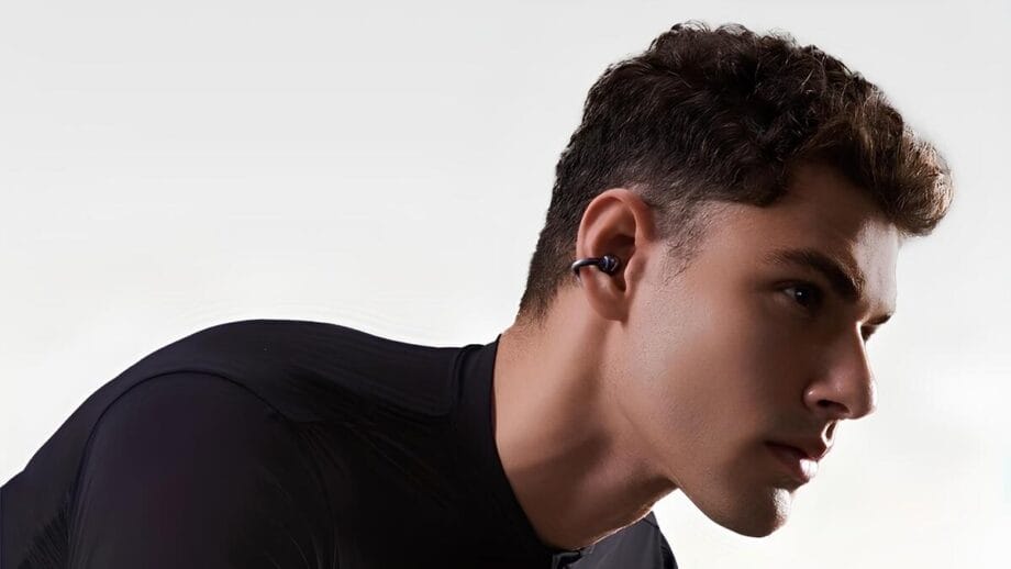 Person wearing Sanag S6S Open Ear Clip Earphones, looking to the side.