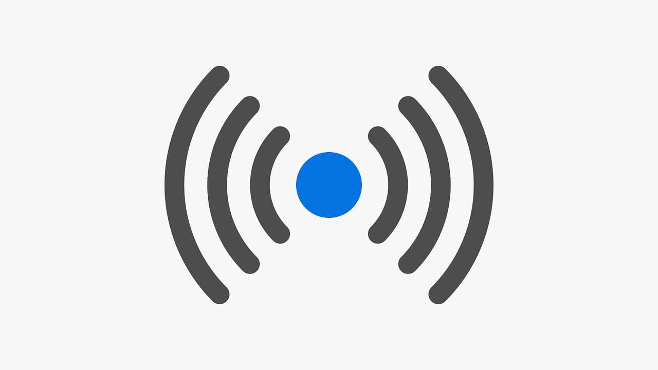 Icon of a blue circle with concentric gray curved lines on both sides, resembling a wireless signal symbol.