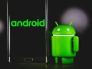 A smartphone displaying "android" next to a small green Android figure on a dark background.