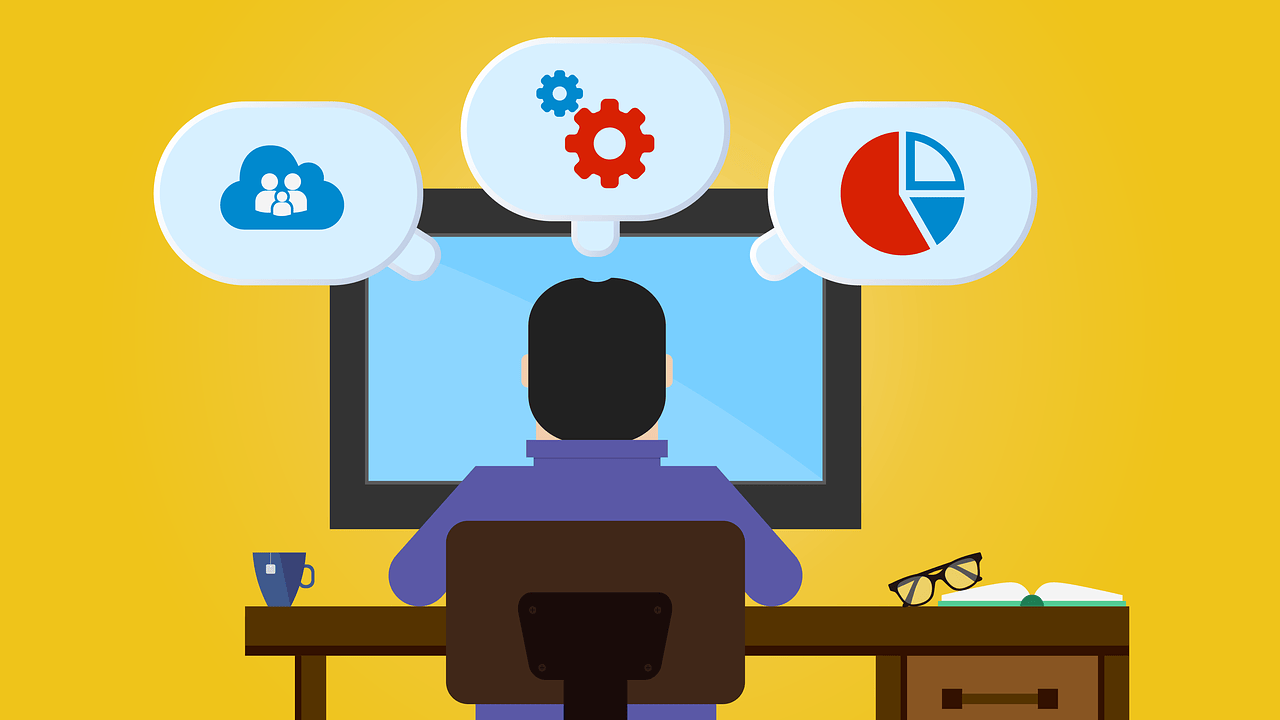 Person at a desk facing a computer. Thought bubbles display icons of a cloud network, gear, and pie chart. Nearby are a mug, glasses, and a book.