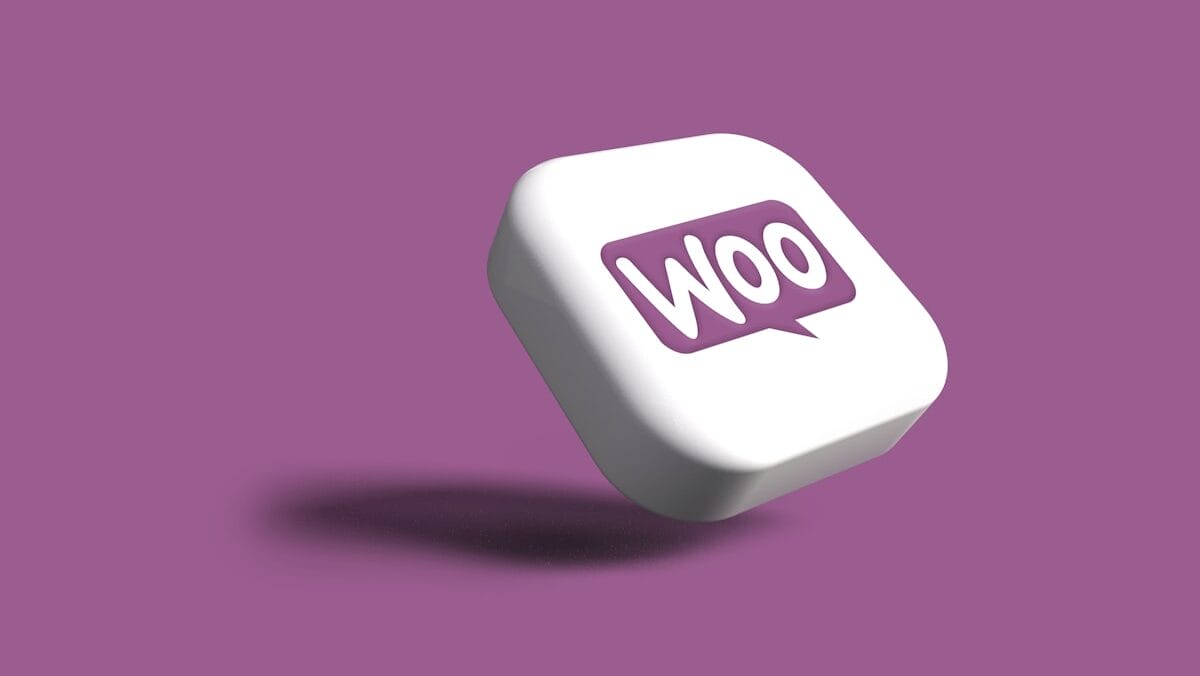 A white 3D square button with a purple Woo speech bubble logo, floating above a purple background.