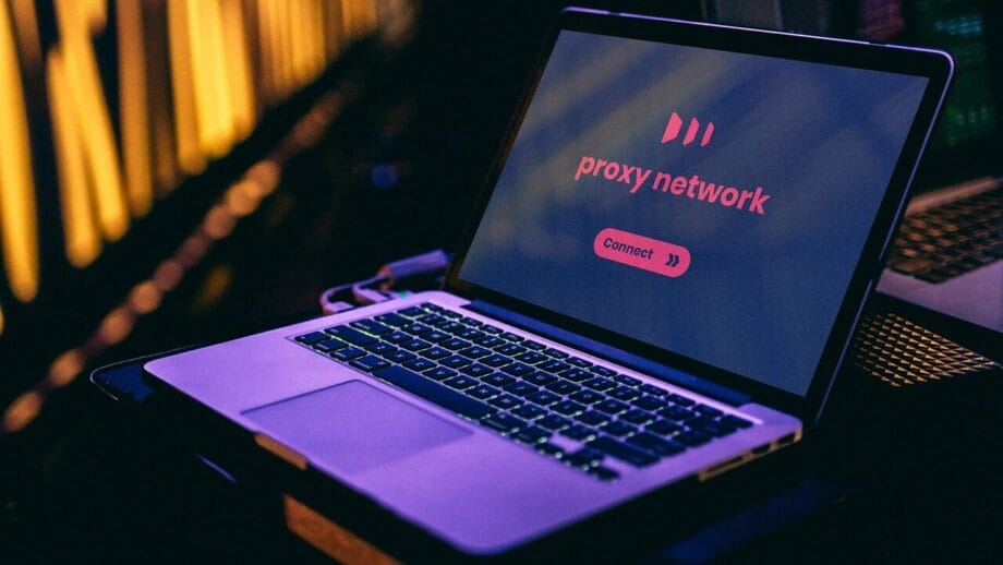Open laptop displaying a proxy network screen with a Connect button, set against a background with soft yellow lighting.