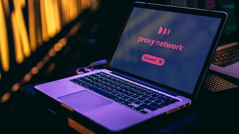 Open laptop displaying a proxy network screen with a Connect button, set against a background with soft yellow lighting.