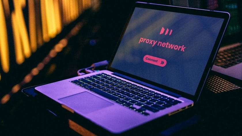 Open laptop displaying a proxy network screen with a Connect button, set against a background with soft yellow lighting.