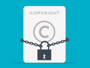 A copyright symbol on a card is wrapped with a chain and secured with a padlock, representing copyright protection.