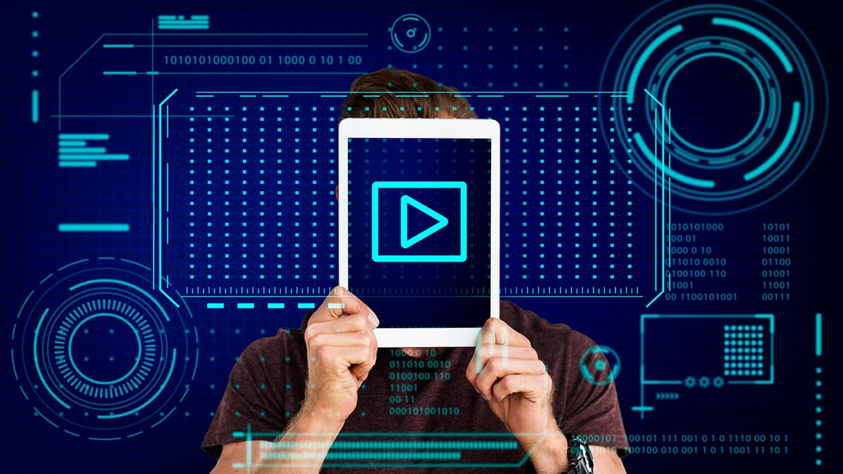 A person holds a tablet in front of their face displaying a play button, with digital graphic elements in the background.