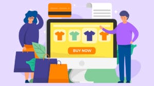 Two people stand by a large computer screen displaying shirts and a Buy Now button, with shopping bags, a credit card, and a receipt nearby.