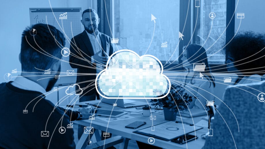 A business meeting with a digital cloud icon overlay, symbolizing cloud computing and data sharing among team members.