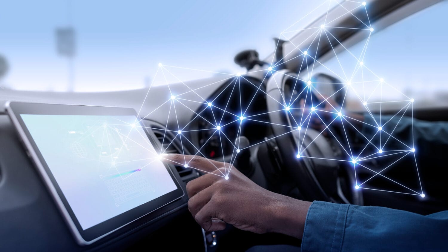 Person interacts with a digital touchscreen interface in a car, with network connection graphics overlaying the image.