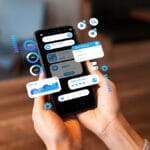 Person holding a smartphone with various digital financial and data analysis graphics displayed as floating overlays.