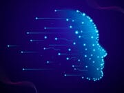 Digital illustration of a human head profile formed by glowing blue dots and lines on a dark background, symbolizing artificial intelligence.