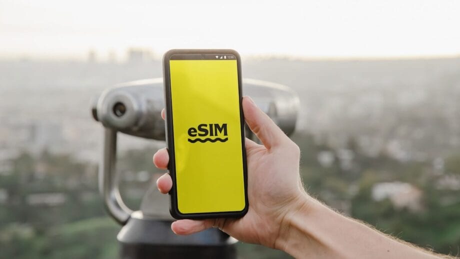 A hand holds a smartphone displaying a screen that confirms an active mobile data plan with a 65MB allowance.