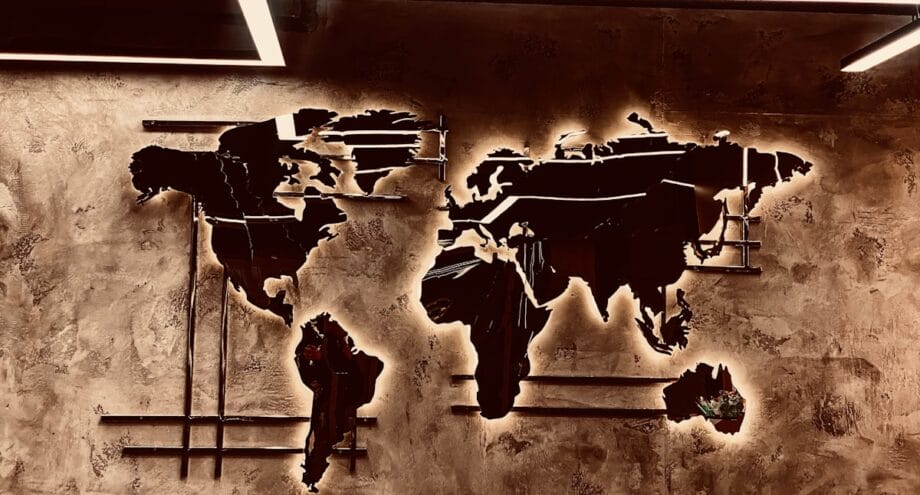 A picture of a world map on a wall
