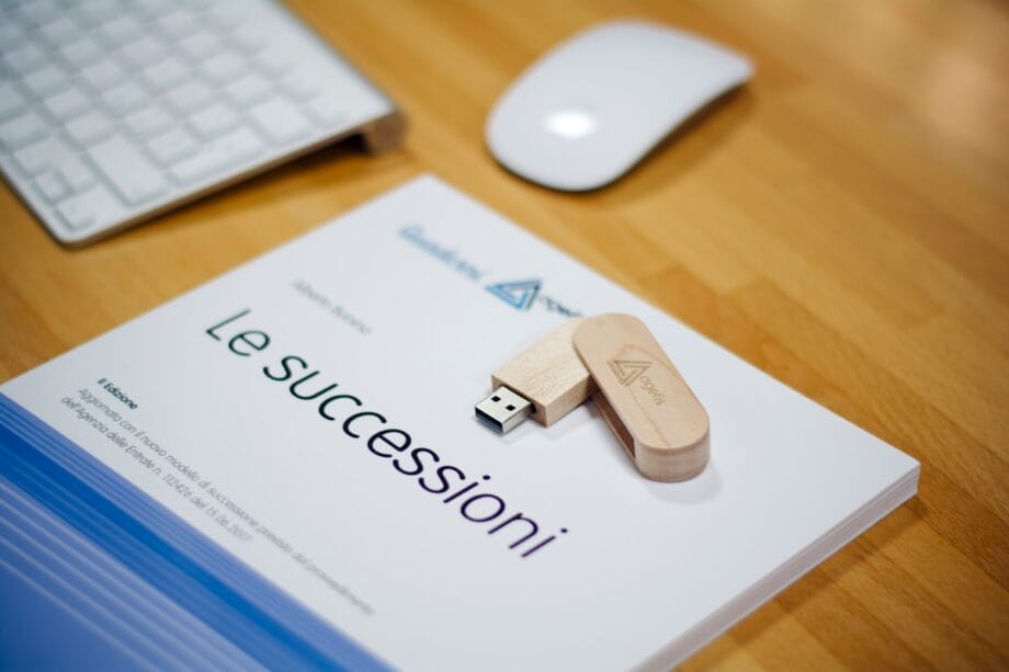 brown thumb drive near Apple Magic Mouse and Keyboard