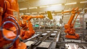 a factory filled with lots of orange machines