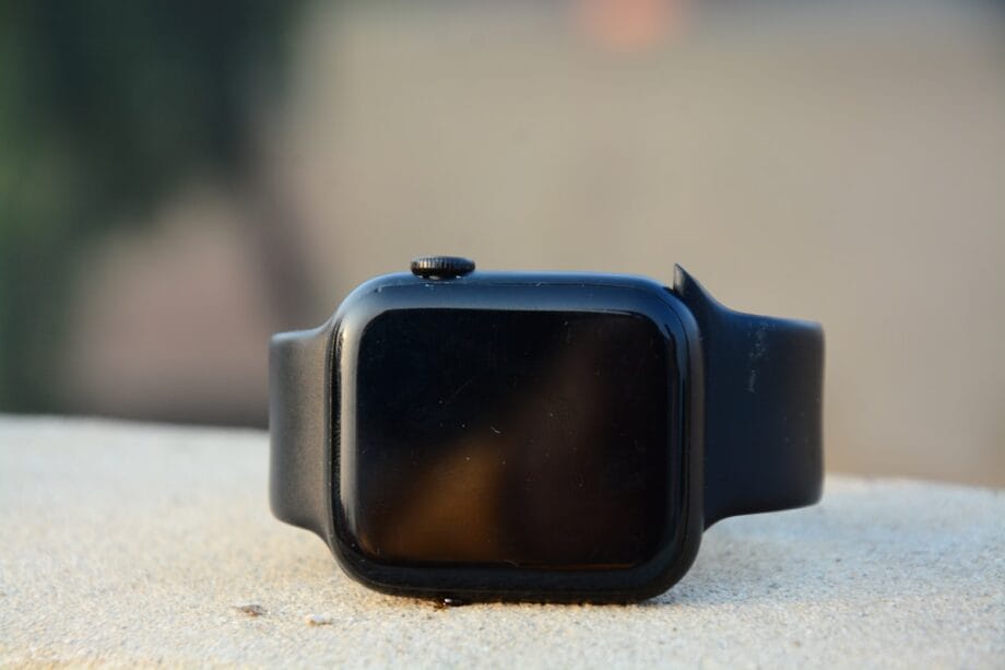 a black watch on a white surface