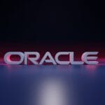 The word ORACLE in bold, 3D letters is displayed on a reflective surface with a dark gradient background.